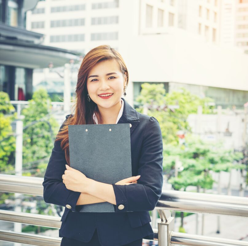young business woman with document hand front building